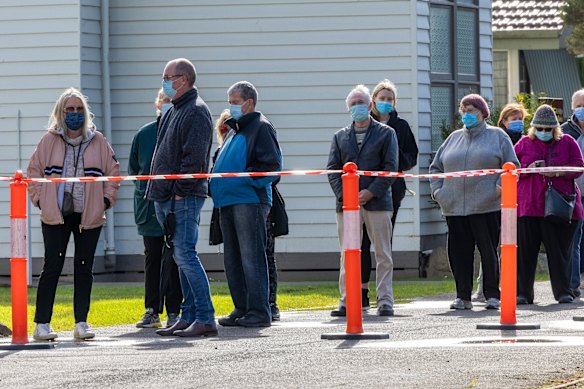 Phillip Island residents wait to be tested for coronavirus at the St Philips Anglican Church. 