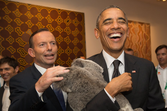 Tony Abbott, Barack Obama and a furry friend from Lone Pine at the Brisbane G20 in 2014.