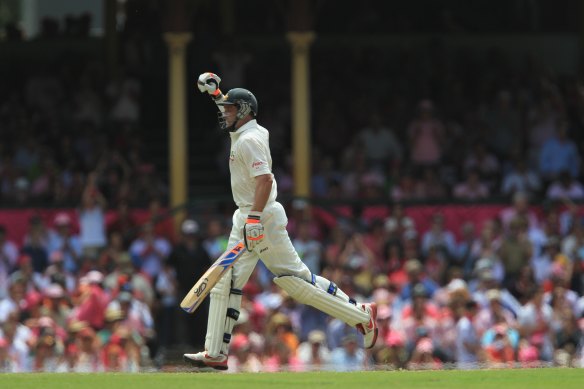 Mike Hussey celebrates a century for Australia.