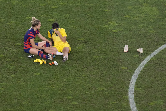 Kerr’s partner Kristie Mewis comforts the Matilda after Australia lost the Tokyo Olympics bronze medal match 4-3 to the US.