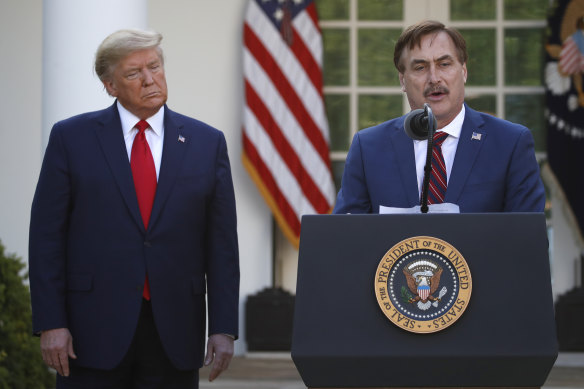 My Pillow CEO Mike Lindell speaks as then-president Donald Trump listens in 2020.