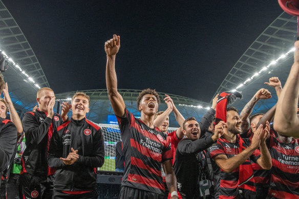 Kusini Yengi leads the celebrations after a Sydney derby win for the Wanderers in 2022.