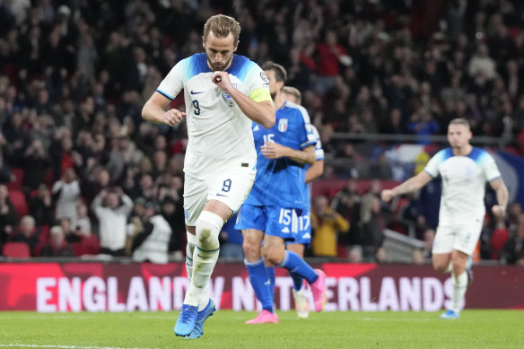 Who else? Harry Kane celebrates his penalty for England.