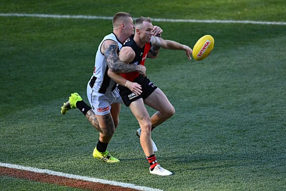 Nick Hind is tackled by Jordan De Goey.