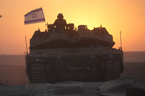 Israeli tanks head towards the Gaza Strip border in southern Israel.