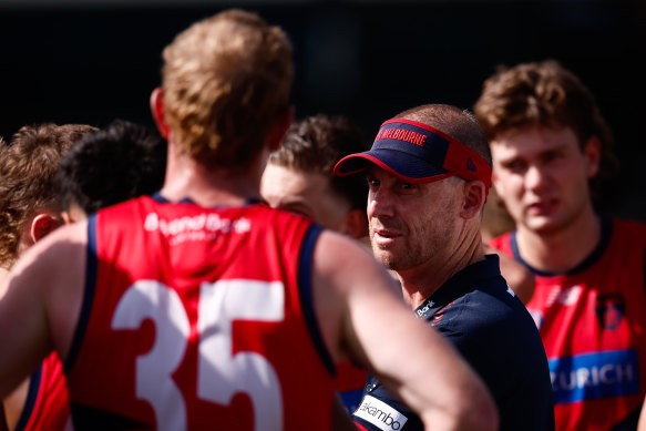 Demons coach Simon Goodwin addresses his players during the pre-season.