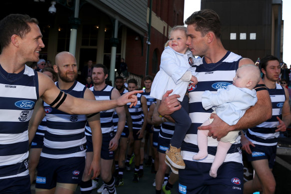 Tom Hawkins with his daughters before game 250 in 2019.