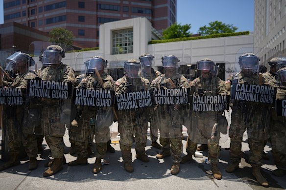 National Guard troops stand their line at the Metropolitan Detention Centre in downtown Los Angeles on Sunday.