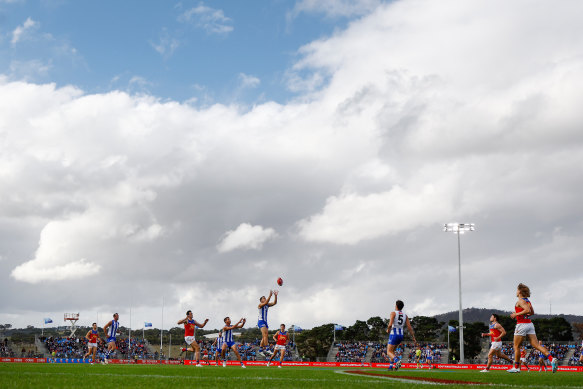 The big men fly: Action in Saturday’s clash between the Lions and Kangaroos.