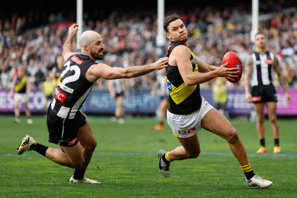 Daniel Rioli evades Steele Sidebottom.