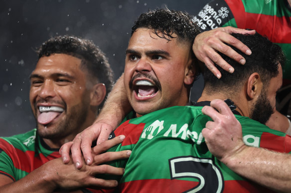 Latrell Mitchell celebrates Alex Johnston’s try on Friday night.