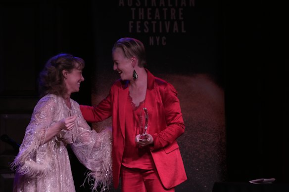 Carmel Dean (right) accepts an award for her contribution to the Australian performing arts scene in New York.