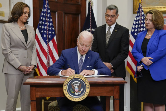 President Joe Biden signs an executive order on abortion access at the White House.