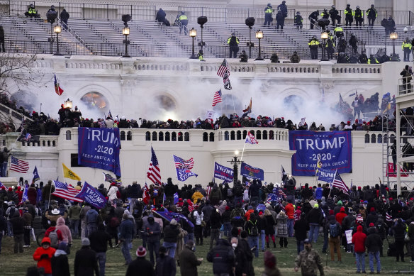 Insurrectionists loyal to then US president Donald Trump breach the Capitol in Washington on January 6, 2021.