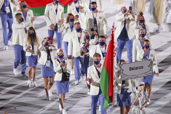 The Belarusian team enters the opening ceremony of the Tokyo Olympics last week. Two officials have now been sent home. One athlete has defected to Poland.