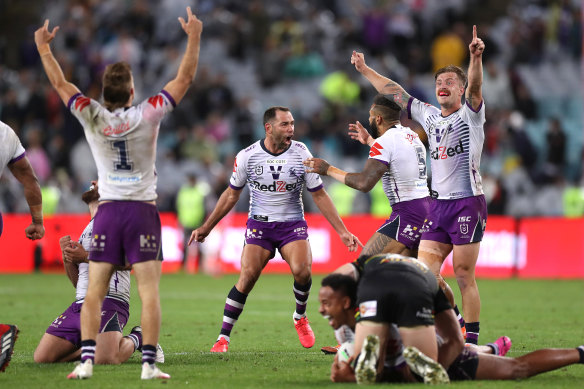 Cameron Smith and the Storm celebrate the final whistle at ANZ Stadium.