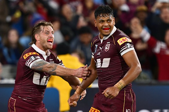 Selwyn Cobbo and Cameron Munster celebrate a try.