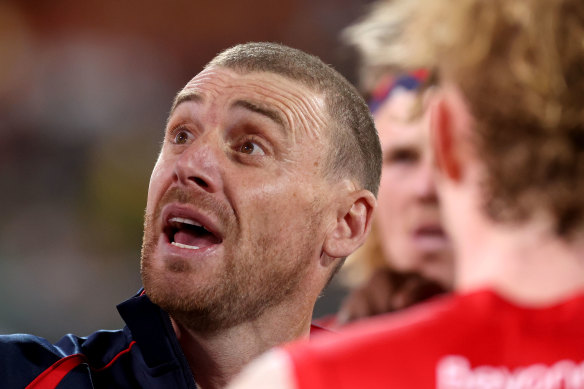 Simon Goodwin talks to his players during the match.