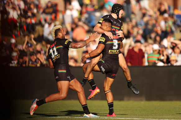 Viliame Kikau and Matt Burton celebrate during their time together at the Panthers.