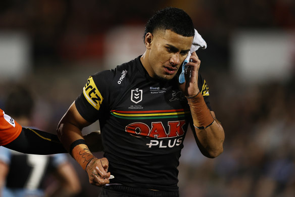 A dazed Stephen Crichton walks from the field.