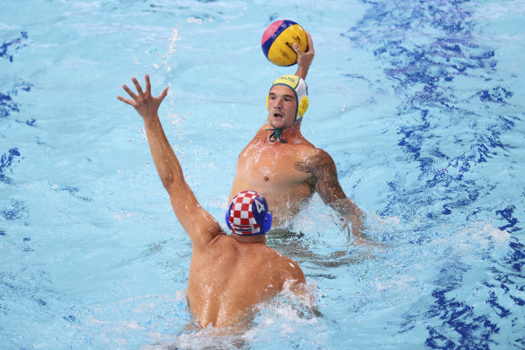 Aaron Younger is challenged by Croatia’s Luka Loncar.