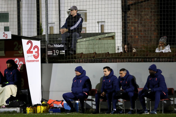 Tottenham manager Jose Mourinho watches on directly below a fan watching from outside the ground during Spurs' 5-0 FA Cup win over Marine.