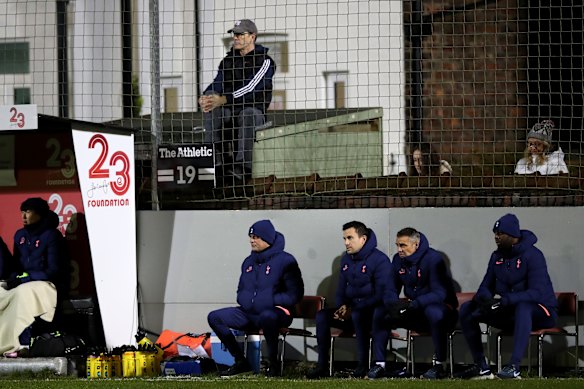 Tottenham manager Jose Mourinho watches on directly below a fan watching from outside the ground during Spurs' 5-0 FA Cup win over Marine.