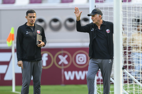 Tim Cahill with former Qatar boss Carlos Queiroz before a training session in Doha.