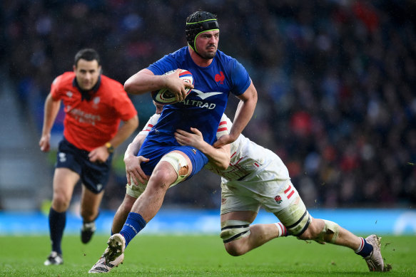 Gregory Alldritt of France is tackled by Jack Willis.