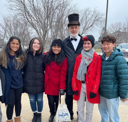 In Iowa, Andrew Sun (right) and his Duke University friends with a Trump fan dressed as Abraham Lincoln.
