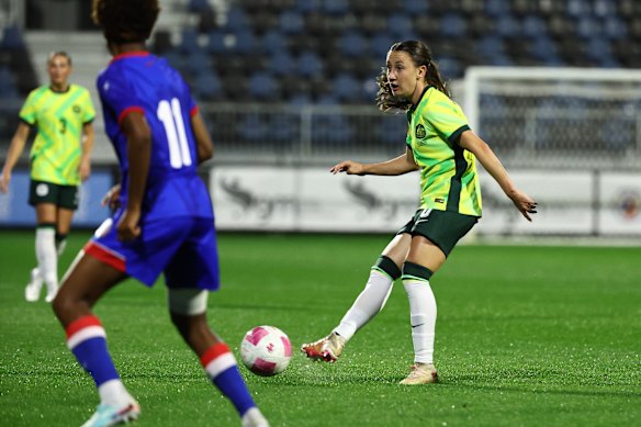 Clare Wheeler looks for a pass.