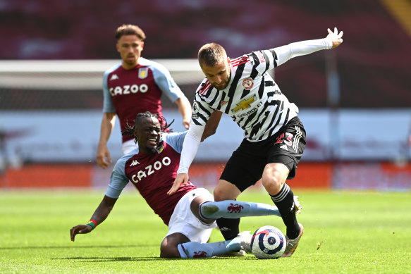 Luke Shaw of Manchester United is tackled by Villa’s Bertrand Traore.