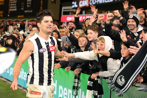 Lachie Schultz greets the Pies faithful post-game.