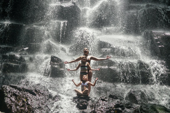 Rikki-Lee Rial and her daughters posing at Kato Lampo waterfall. 