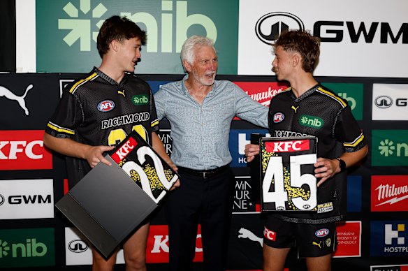  Debutants, Sam Cumming (left) and Tom Burton of the Tigers (right) are seen with Mick Malthouse (centre).