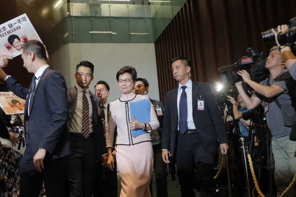 Hong Kong chief executive Carrie Lam is greeted by protesting politicians as she arrives in Parliament.