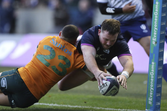 Ewan Ashman scores for Scotland.