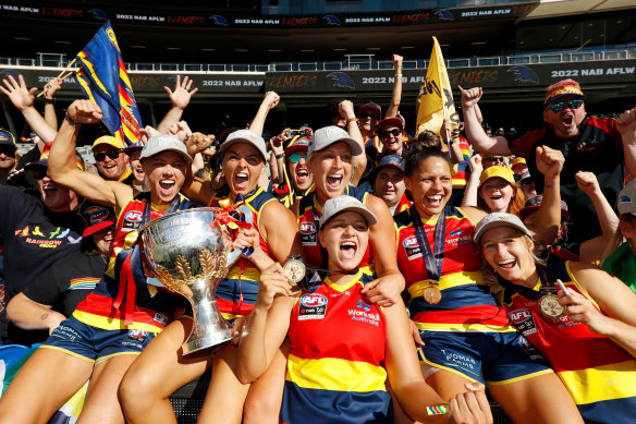 Erin Phillips, Ebony Marinoff, Danielle Ponter, Marijana Rajcic, Stevie-Lee Thompson and Nikki Gore of the Crows celebrate with fans. 