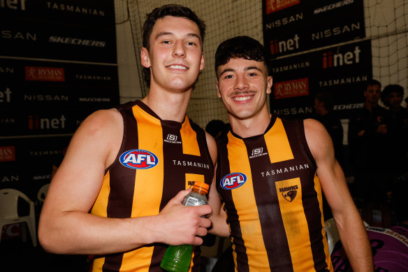 Macdonald with Massimo D’Ambrosio, who made the switch to the Hawks from their old enemy, the Bombers.