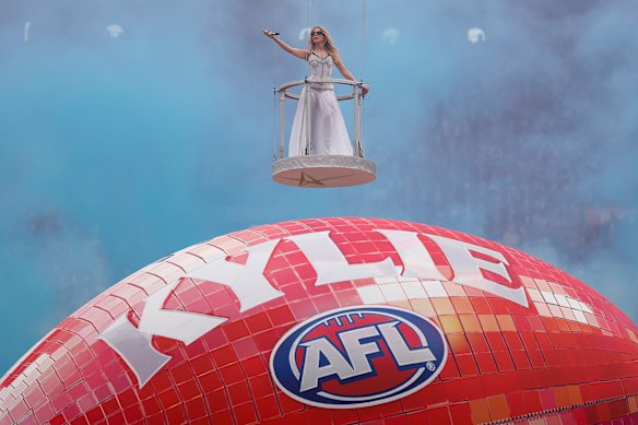 Minogue floats above the MCG moments before the AFL grand final kicks off.