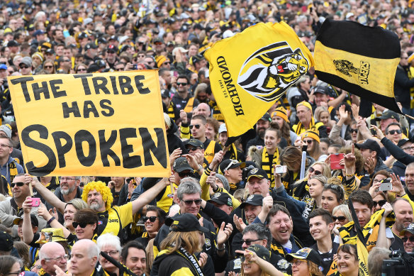 Tigers fans are seen at Punt Road Oval in Melbourne after winning the 2017 grand final.