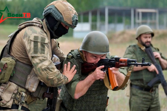 An image from a Belarus defence video shows a Wagner fighter conducting training for Belarusian soldiers on a range near the town of Osipovichi on July 14.