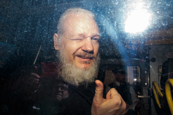 Julian Assange gestures to media from a police vehicle on his arrival at Westminster Magistrates court in April.
The Ecuadorian Embassy in London had withdrawn his asylum after seven years.