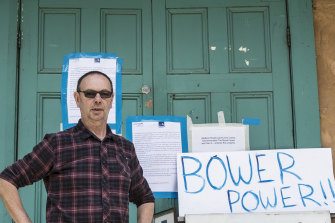 The Bower general manager Guido Verbist standing in front of eviction notices.
