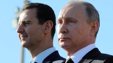 Russian President Vladimir Putin, right, and Syrian President Bashar al-Assad in December.