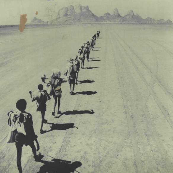 Ethiopian refugees, carrying their possessions, cross the border into Sudan in 1984 on their way to a refugee camp. This group walked almost 300km in nine days and nights from the town of Sheraro in Ethiopia’s Tigray province. 