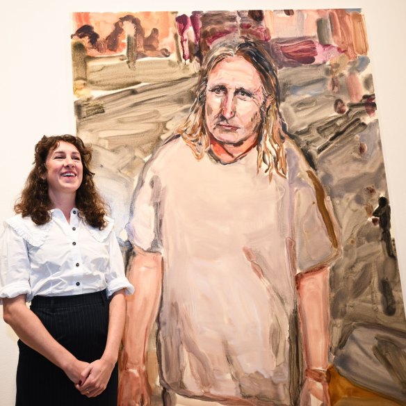 Laura Jones with her portrait of Tim Winton.