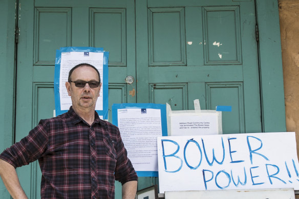The Bower general manager Guido Verbist standing in front of eviction notices.