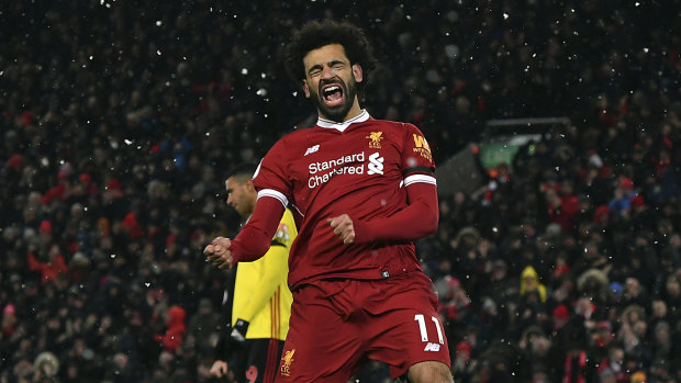 Liverpool's Mohamed Salah celebrates scoring his hat-trick. 