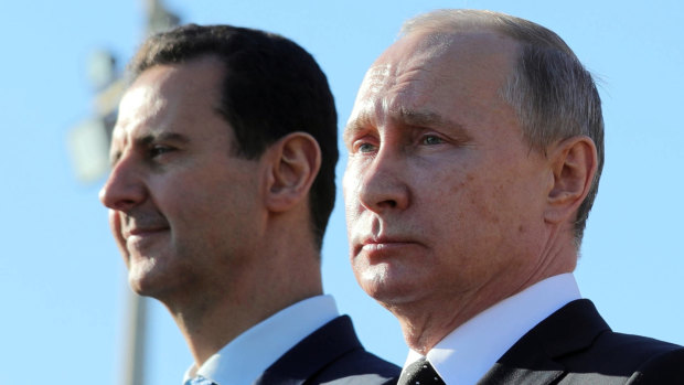 Russian President Vladimir Putin, right, and Syrian President Bashar Assad in December.